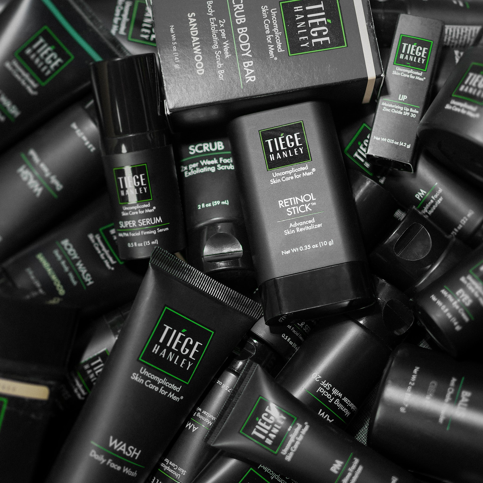 Various Tiege Hanley products are arranged to fill the entire image. 